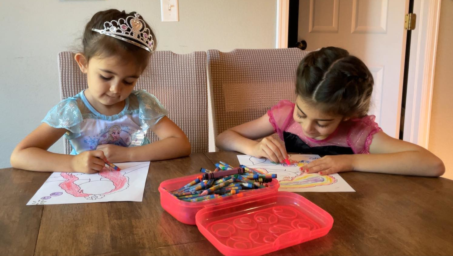Madison and Ari are having a blast coloring their pages