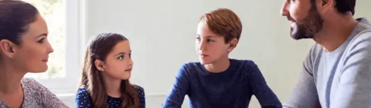 Family discussion around a breakfast table